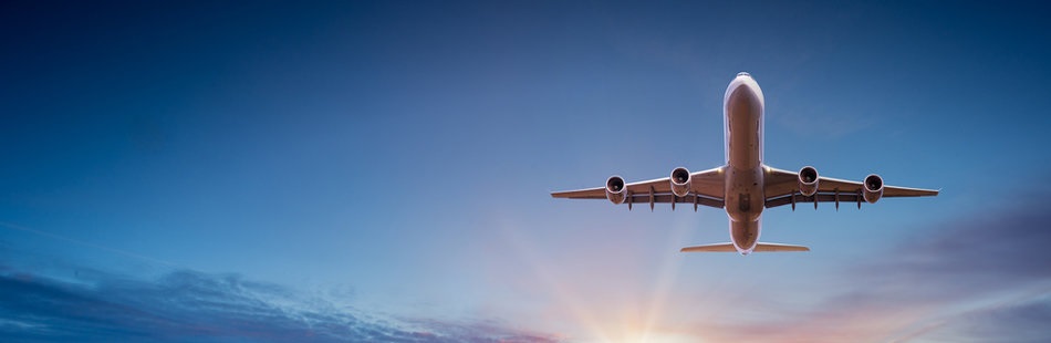 Airplane flying over beautiful landscape